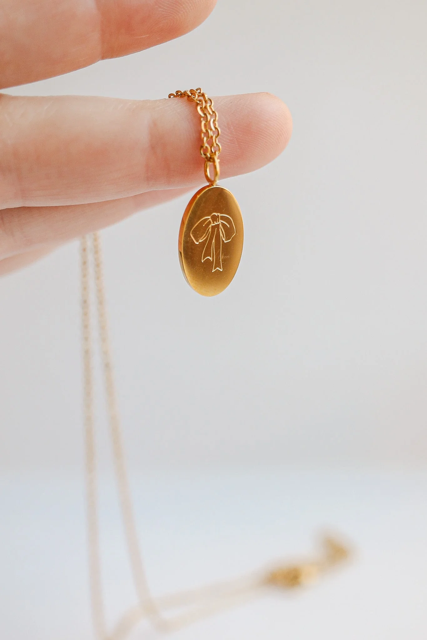 Bow Pendant Necklace in Gold - Image 5